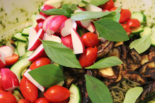 Soba noodles with grilled eggplant, radishes, tomatoes, cucumbers, and Thai basil