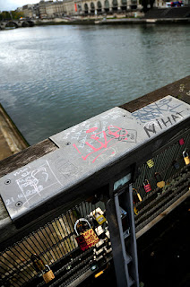 Graffiti on the bridge balustrade above The Seine in Paris