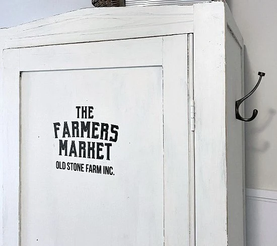 Painted storage hutch with Farmers Market Sign