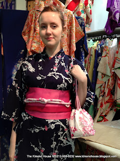 A Young lady wearing a new cotton kimono and obi