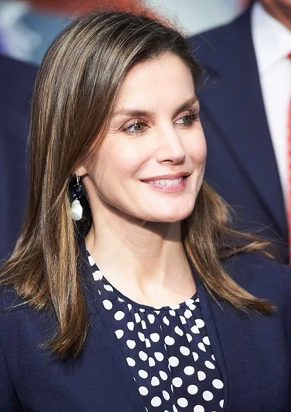 Queen Letizia wore Carolina Herrera blouse and Hugo Boss suit