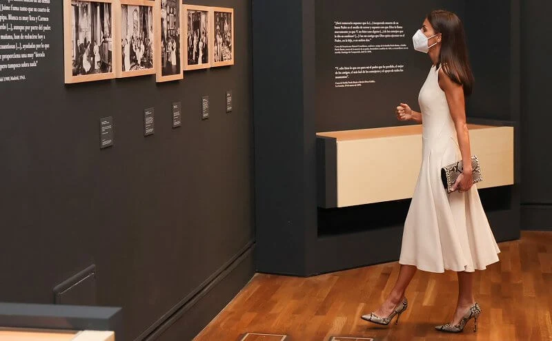 Queen Letizia wore an ivory midi dress by Spanish designer, Pedro Del Hierro, and snake printed pumps by Magrit. Gold And Roses earrings