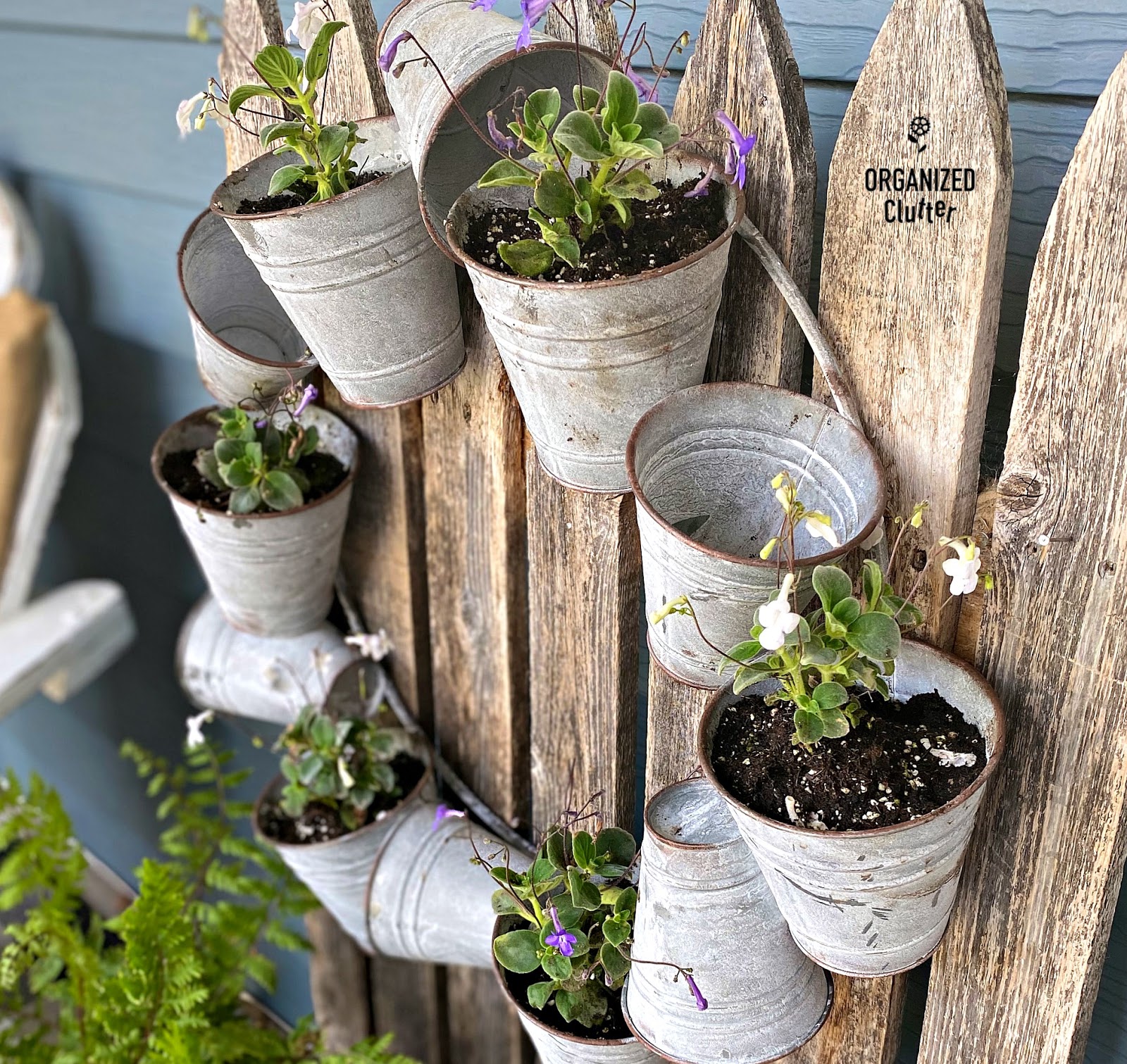 Galvanized Bucket Wreath with Violets Organized Clutter