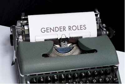 typewriter with a sheet of paper, on which GENDER ROLES is written in capital letters