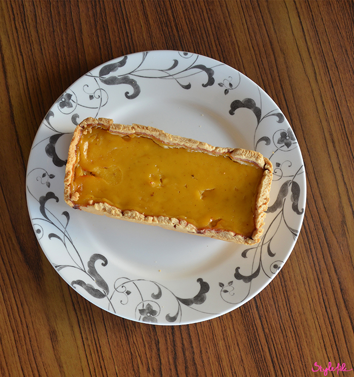 Image of homemade pumpkin pie placed on a wooden background which is often eaten as dessert for Thanksgiving and in autumn