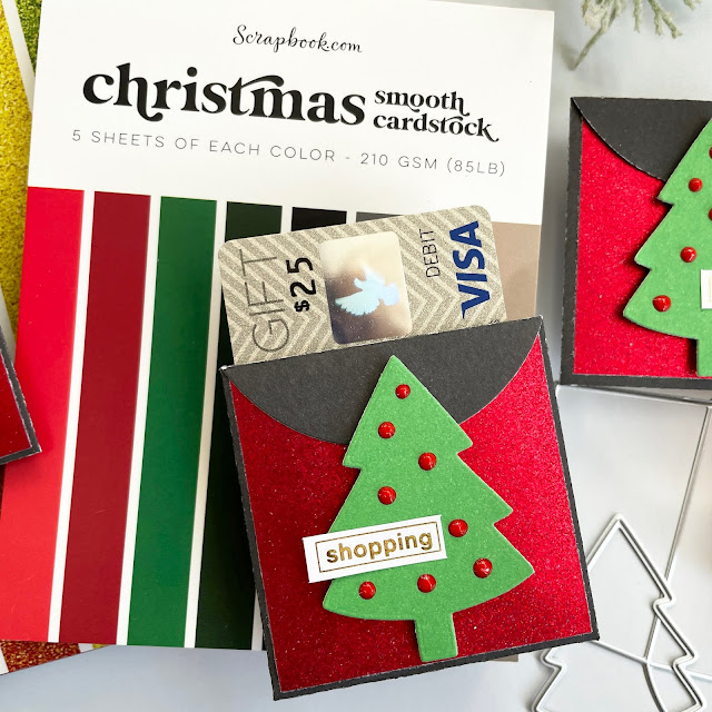DIY Christmas Gift Card holder made with: Scrapbook.com rainbow glitter paper, Christmas smooth cardstock; pops of color rudolph red, nested fir tree die, mini envelopes die, mint tape