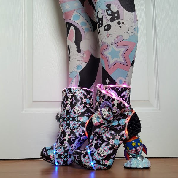 irregular choice ankle boots with LED lighting being worn
