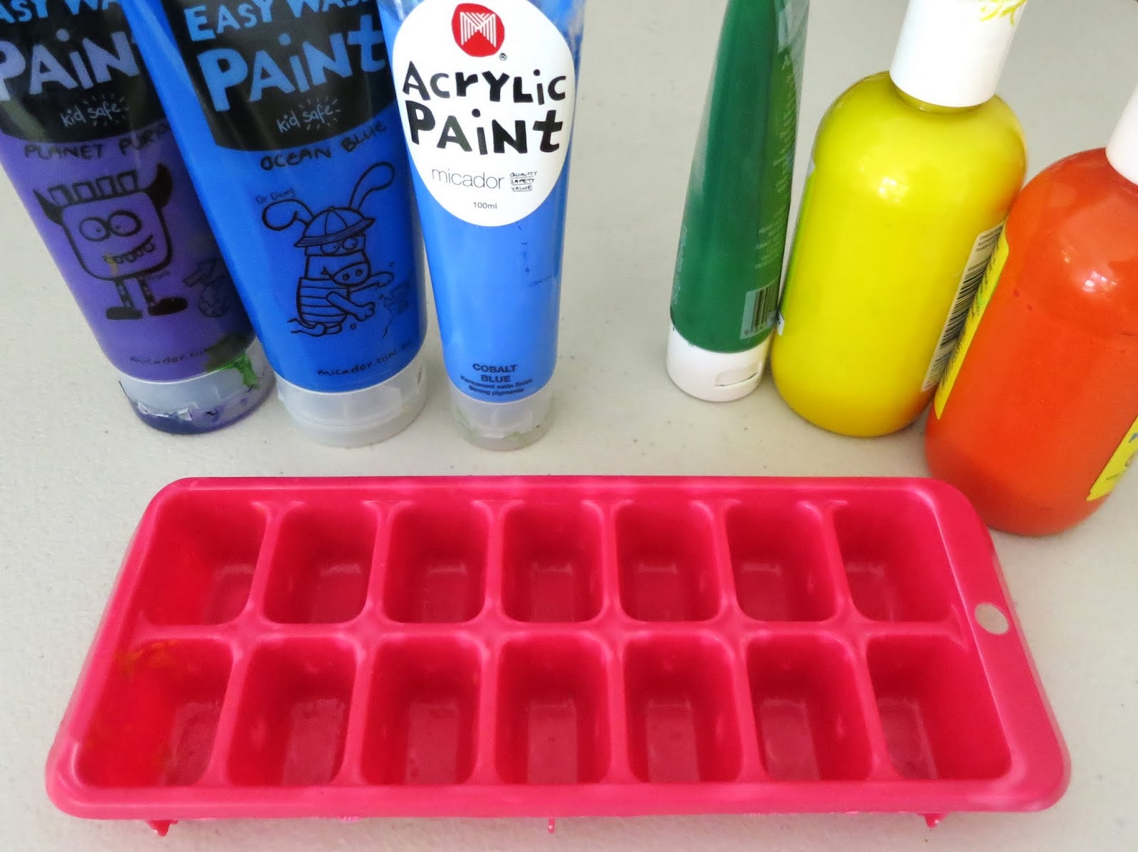 Learn with Play at Home Paintsicles. Frozen paint cubes for creative fun.