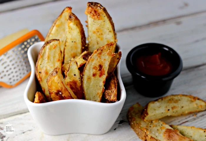 Crispy Oven-Baked Garlic Parmesan Potato Wedges | by Renee's Kitchen Adventures - A healthy side dish with a secret for perfectly crispy oven potatoes!  Crunchy on the outside and fluffy on the inside! 