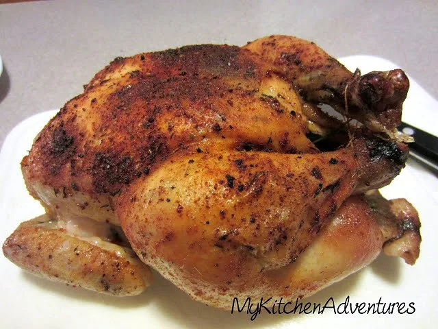 Perfect Roasted Chicken by Renee's Kitchen Adventures cooked on white serving platter ready to carve