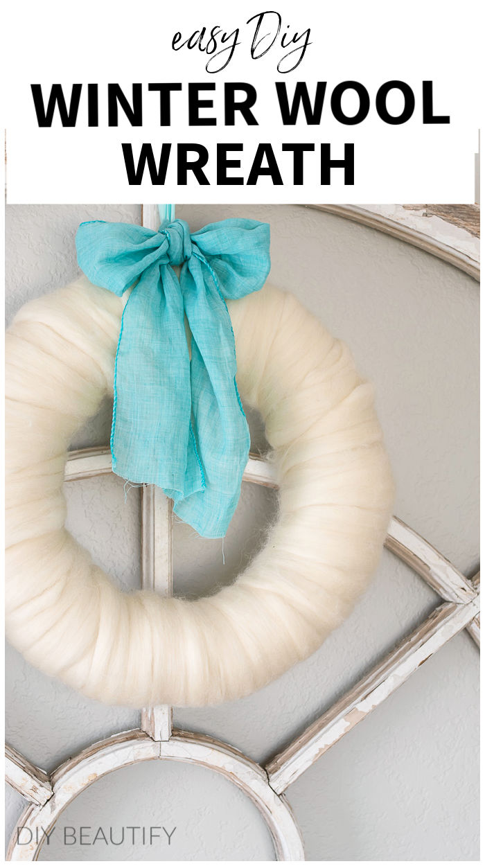 natural wool wreath with fabric ribbon bow