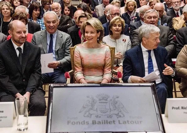 Queen Mathilde was glowing in a bold, form-fitting pastel-hued dress, she wore with a pair of classic nude heels, as she arrived at the Baillet Latour Health Prize ceremony