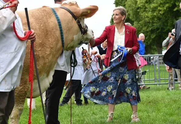 Countess of Wessex wore a floral-print crepe midi skirt by Erdem, Alexander McQueen slim fit blazer, pearl earrings