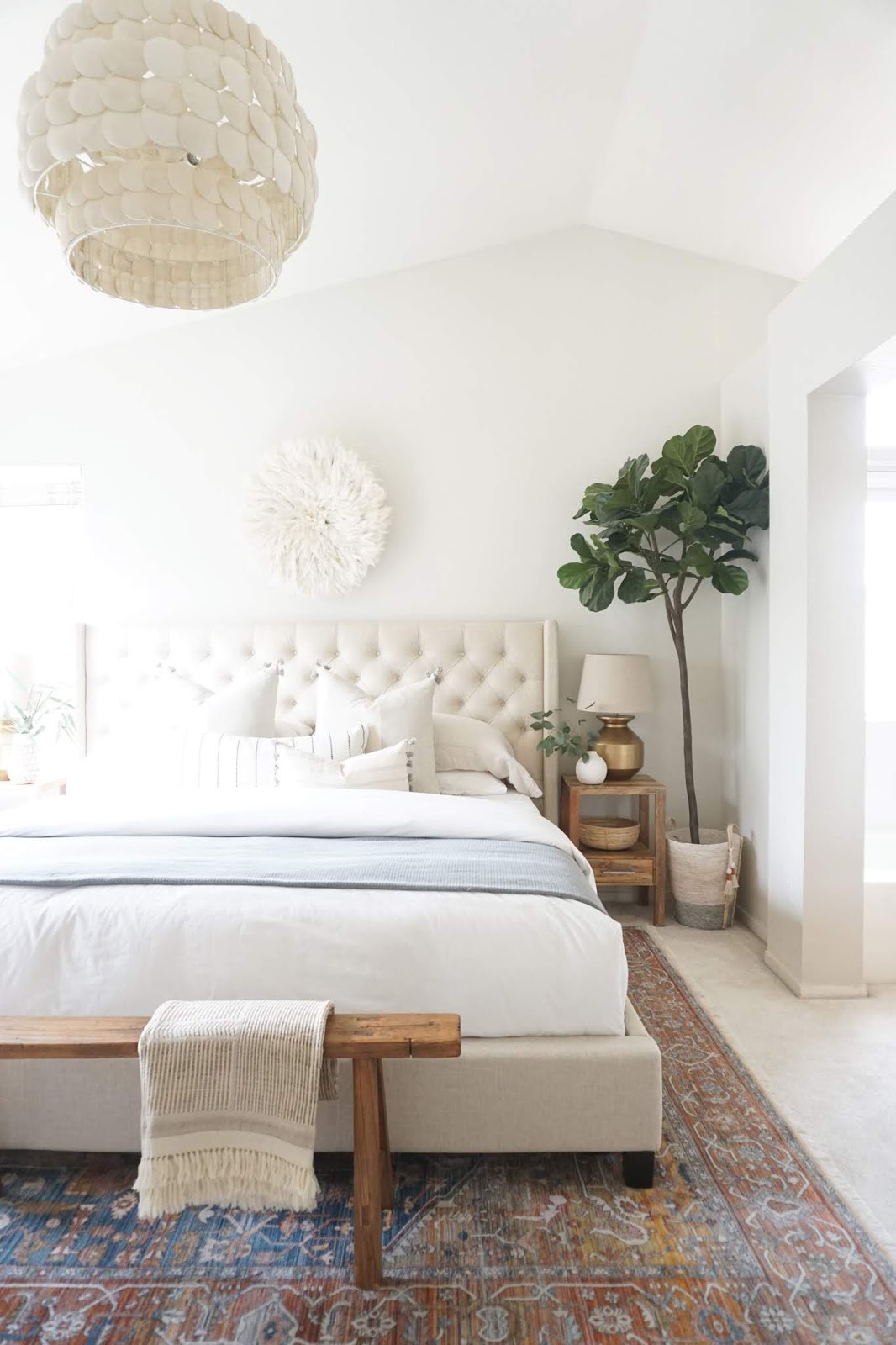 Serene master bedroom with colorful rug