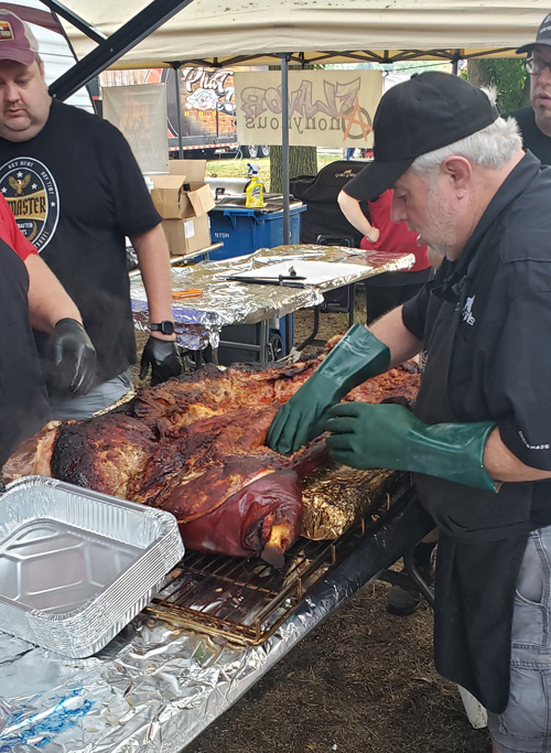 Preparing whole hog BBQ at the 2019 Praise The Lard BBQ Contest