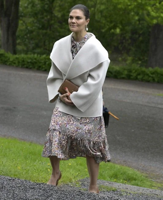 Crown Princess Victoria wore a printed bow dress from by Timo, and ivory annecy jacket from Toteme