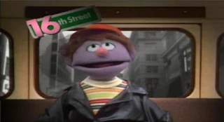 Forty Blocks from My Home is sung by the muppet Farley. Sesame Street Elmo's Travel Songs and Games