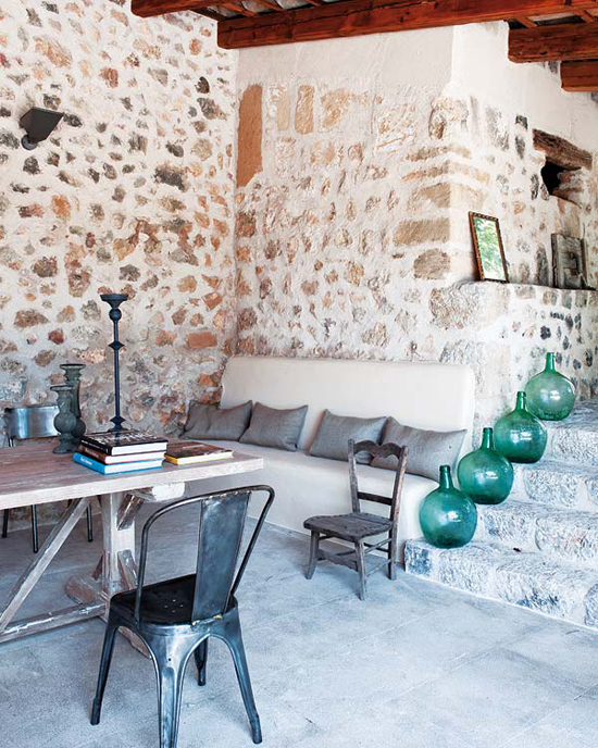 A country villa in Mallorca, Spain, with bare stone walls and pebble floors. See more at www.myparadissi.com