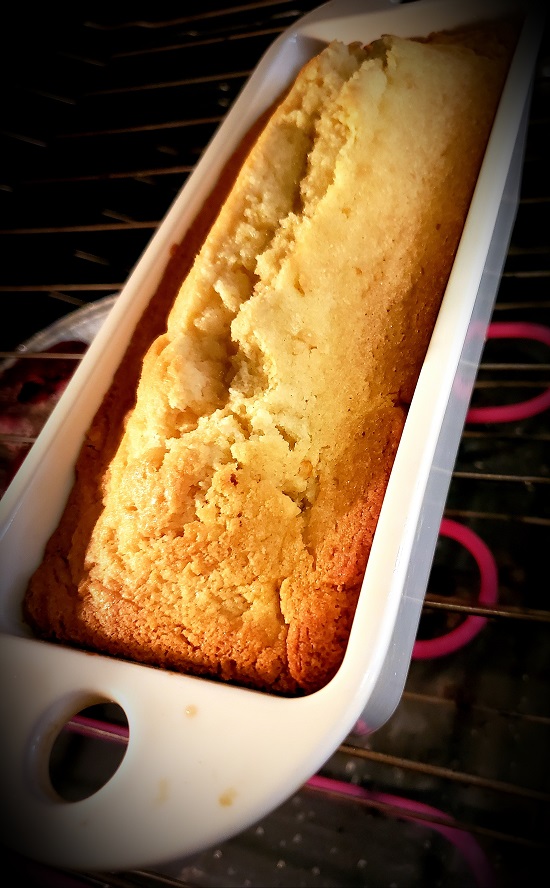 This is a lemon loaf cake baked in a Revol loaf pan and is in the oven with it on baking. This cake is heavy and dense like a pound cake with a crack down the center which is a characteristic of heavier cakes.