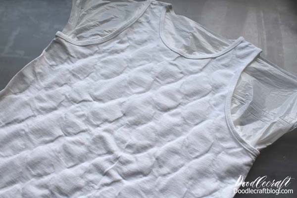 Once dry, you can turn the shirt over and continue the scales on the other side if desired.