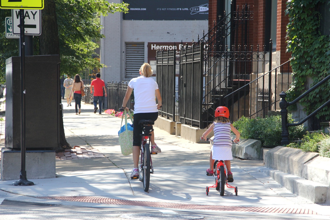 should bicycles ride on the sidewalk