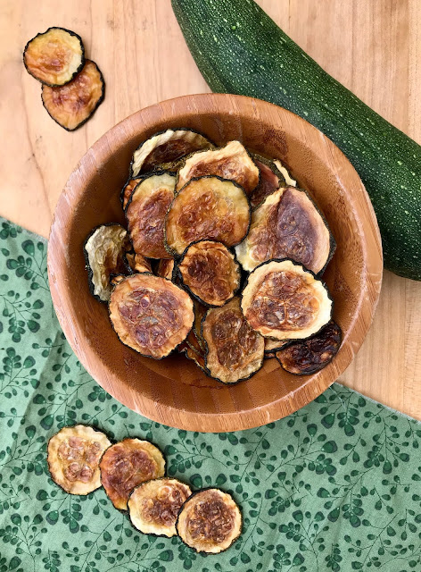 Finished bowl of oven baked zucchini chips.