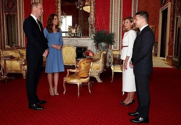 Kate Middleton wore a blue v-neck belted bespoke dress from Emilia Wickstead, and her praline Gianvito Rossi pumps. First Lady Olena Zelenska