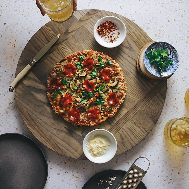 Daiya pizza Plant-based Pizza on cutting board