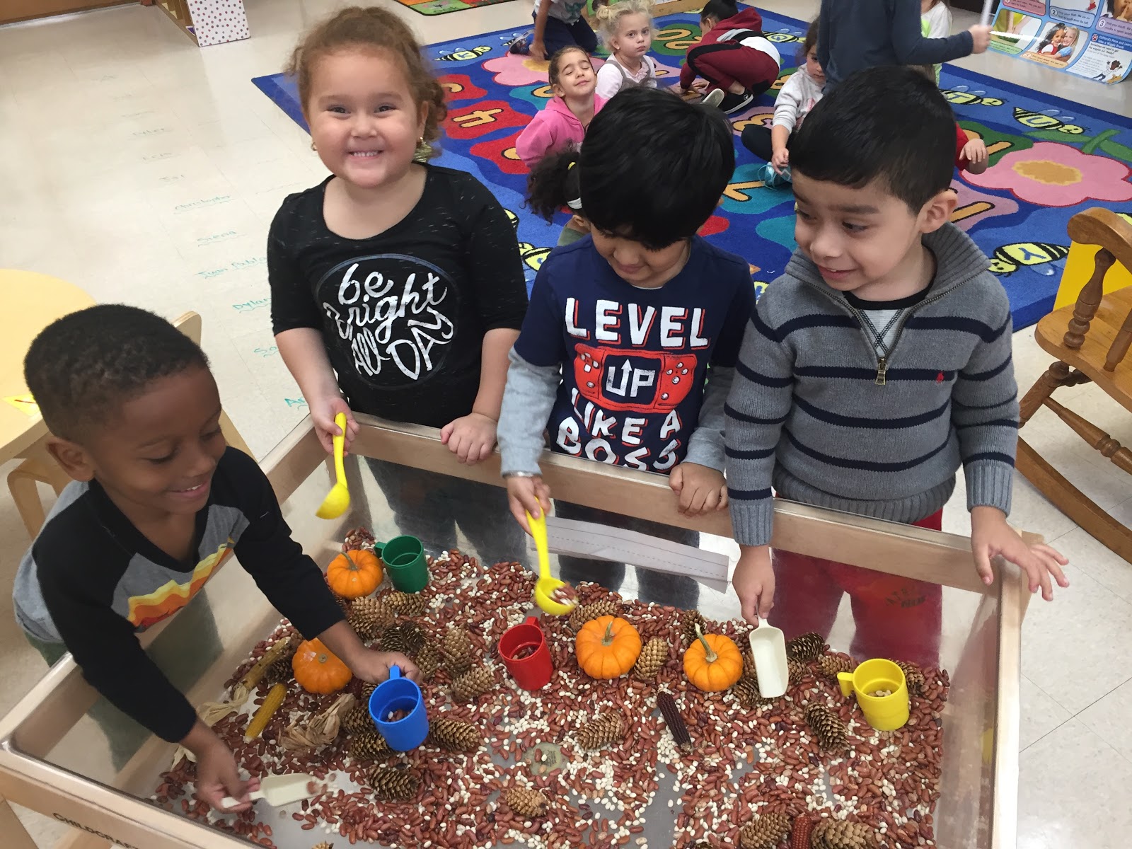 The PreK Post Learning how to use the Sensory Table!