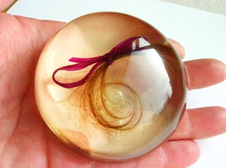 Custom made paperweight containing a lock of hair