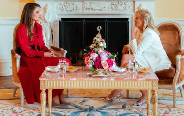 Queen Rania wore a red dress by Hussein Bazaza. First Lady Jill Biden wore J'Adior cotton slingback pumps by Dior