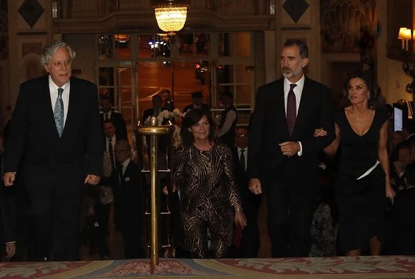 Queen Letizia wore Carolina Herrera dress and Carolina Herrera Pumps. carried Bottega Venata clutch bag. journalist Rubén Amón