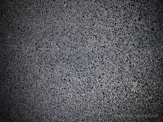 Black Porous Texture Of Pillar Wall Layer Of The House