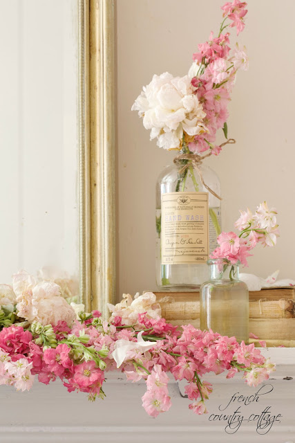 5 minute decorating- Bottles, Books and Blooms on the mantel