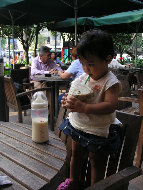 A smaller Kecil sipping coffee from the joint