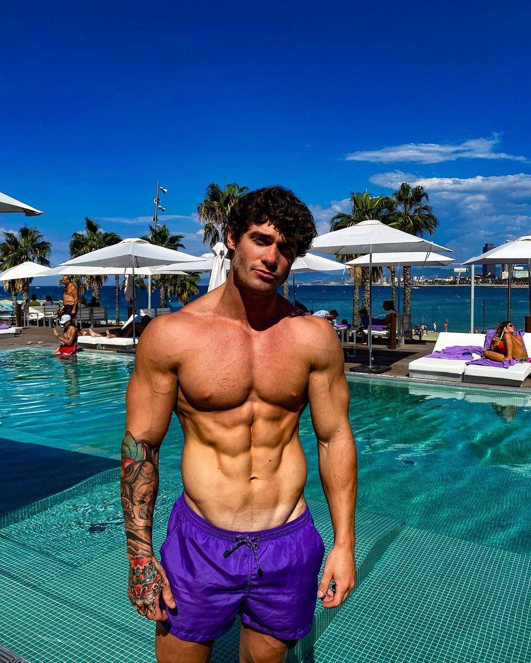 muscular-shirtless-tattoo-dude-owen-harrison-pool-abs-perky-nips