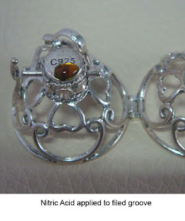 image showing nitric acid applied to fake harmony ball cage