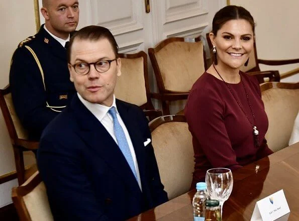 Crown Princess Victoria wore Andiata Kamille trousers and Kiana blouse. Vogt bag and Stinaa J boots. Oscar de la Renta earrings