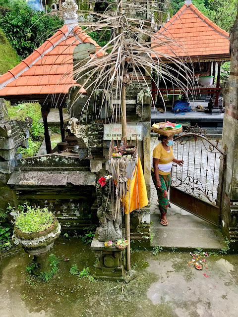 The local Pura or Temple Tegenungan Waterfall, Ubud, Bali, Indonesia