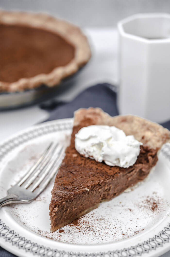 Slice of apple butter pie with coffee The best new fall dessert recipe - Apple Butter Pie