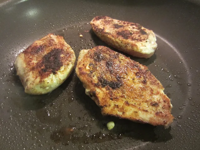 Easy One Pan Chicken and Sausage Jambalaya chicken in pan