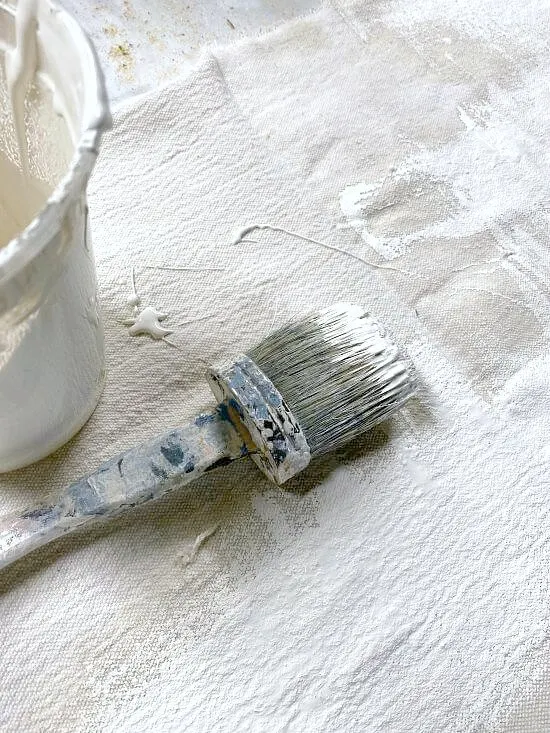 Painting a drop cloth with off white paint