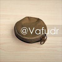 Round Earphone or Small Accessory Bag of tan color