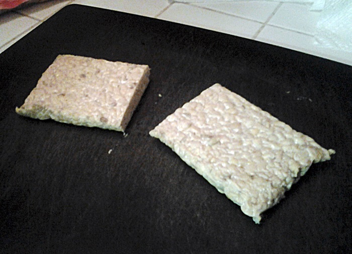 vegan woman Meatless Ground Beef style Tacos made with Tempeh