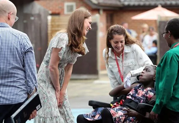 Kate Middleton is wearing a print floral summery midi dress, Castaner wedges and her Catherine Zoraida earrings