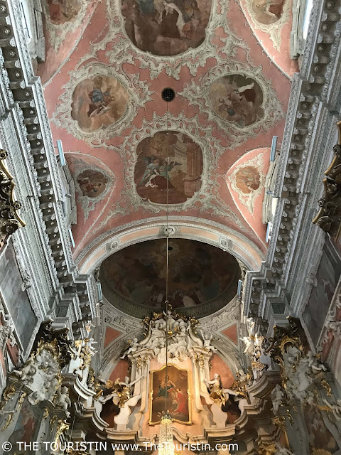 Pastel ornate ceiling of Saint Theresa church in Vilnius in Lithuania