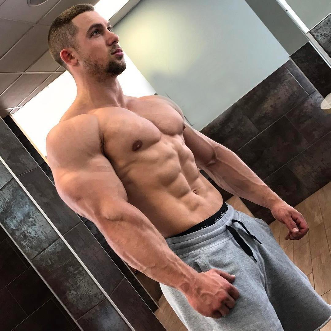 huge-swole-shirtless-muscle-hunk-posing-alpha-male-pecs-biceps-abs-beefcake