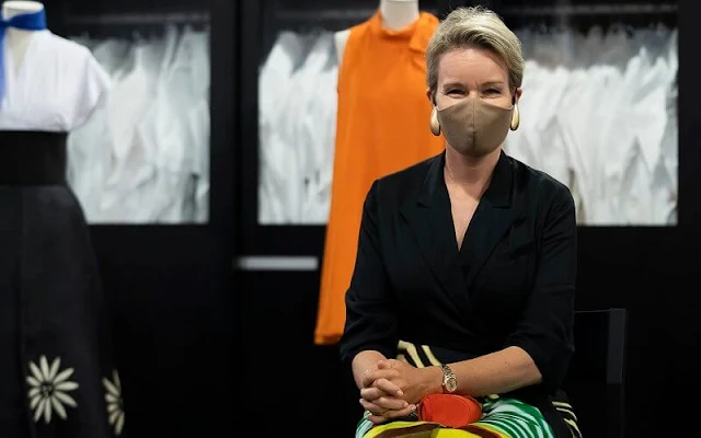 Queen Mathilde wore a skirt and blouse by Dries Van Noten of Spring Summer 2021 collection. Delphine Nardin gold earrings