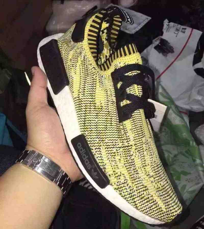 yellow and black nmd