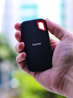 Portable SanDisk Solid State Drive black and orange